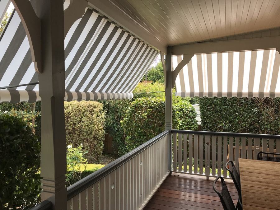 Striped awning shading a timber deck