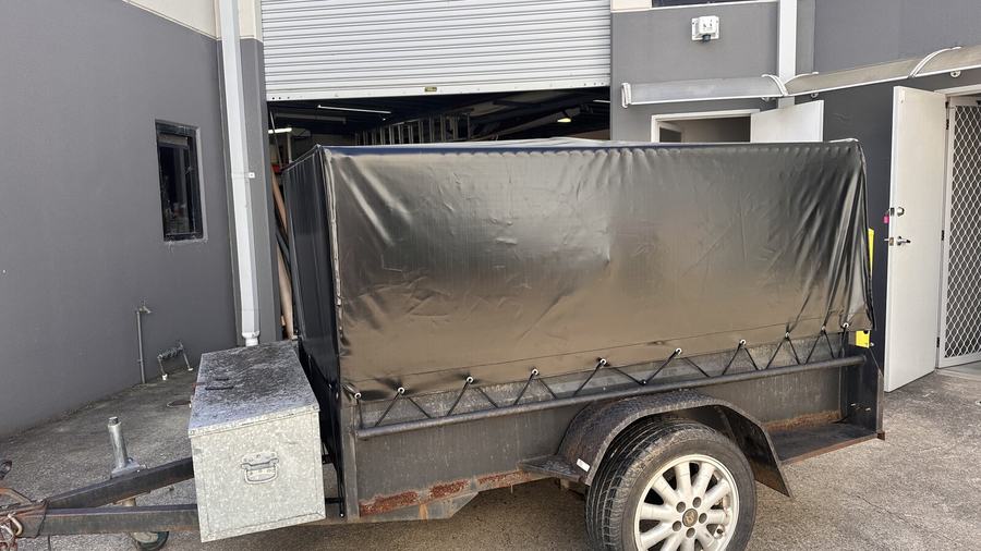 Canvas cover fitted over a box trailer